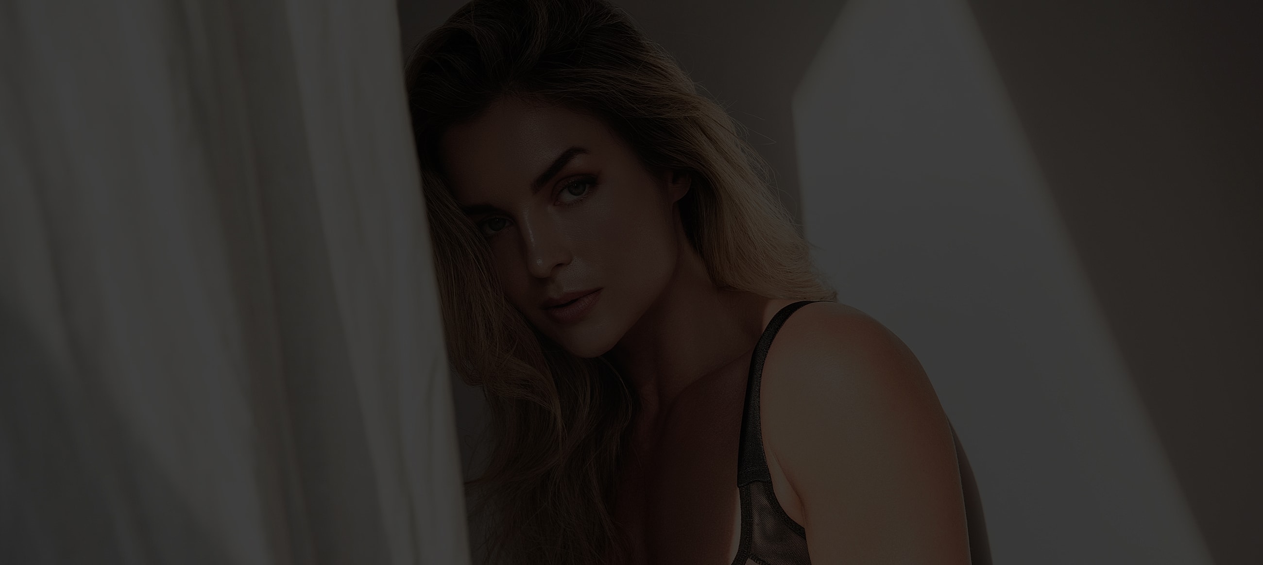 Model with long hair and intense gaze.