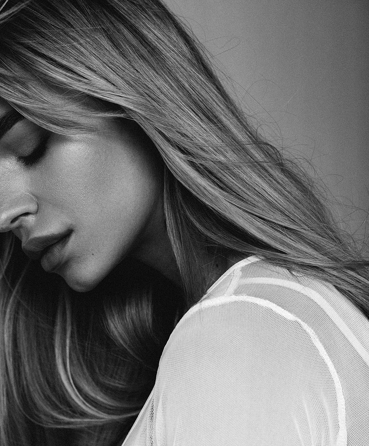 Close-up of a woman with long hair.
