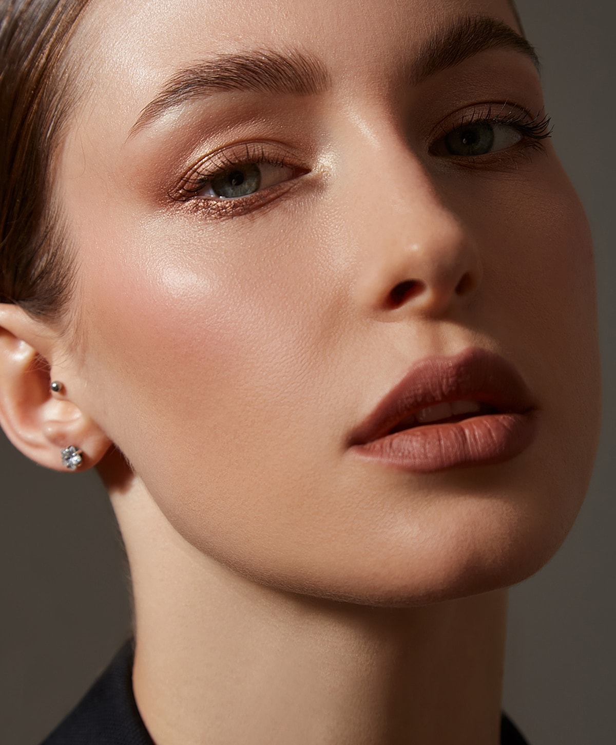 Close-up of a woman's face with makeup.