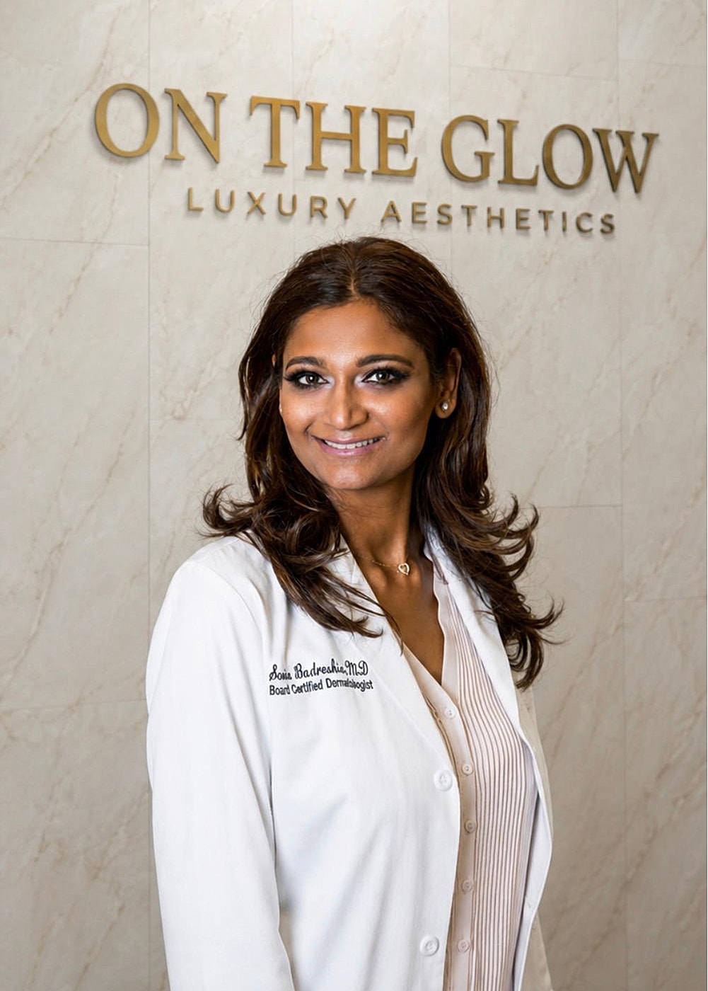 Portrait of a dermatologist in a clinic setting.