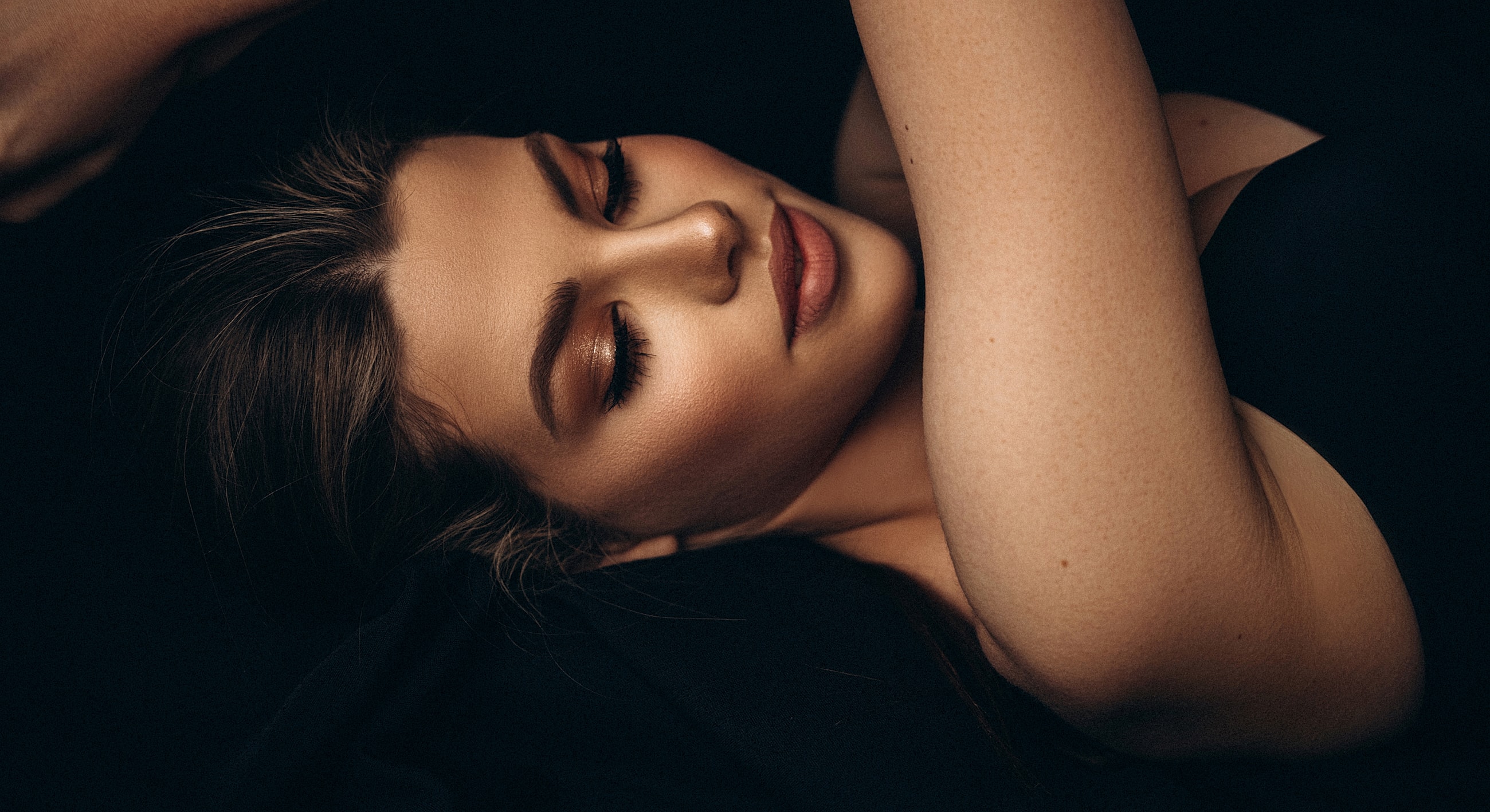 Serene portrait of a woman with flowing hair.