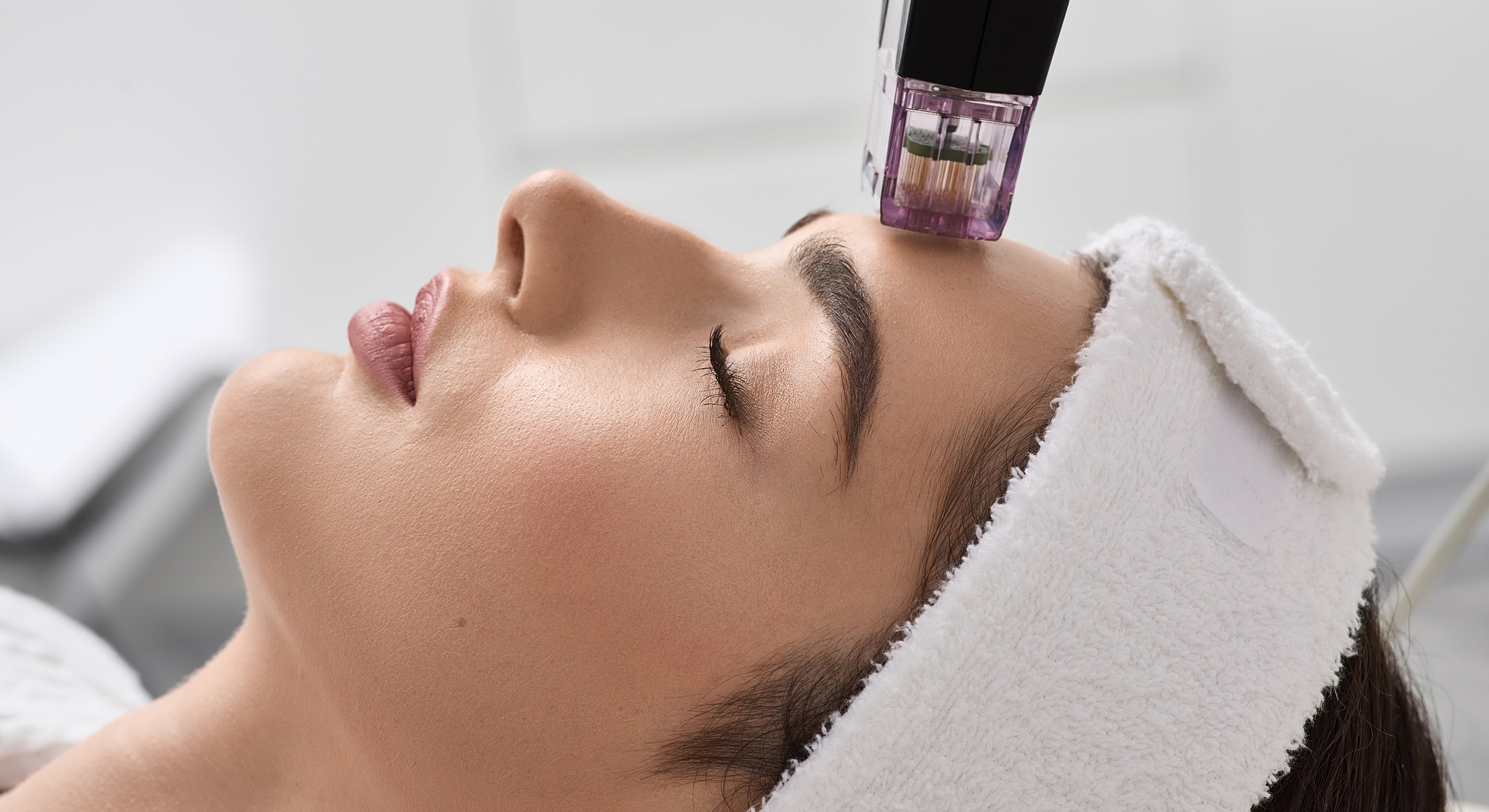 Woman receiving a facial treatment in spa.